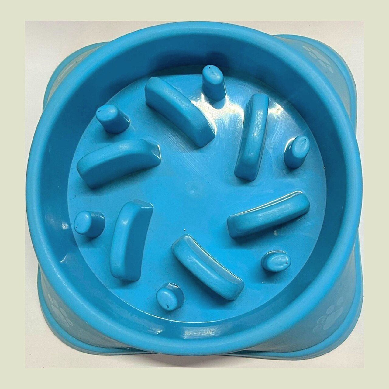 Dog eating from a food puzzle toy
